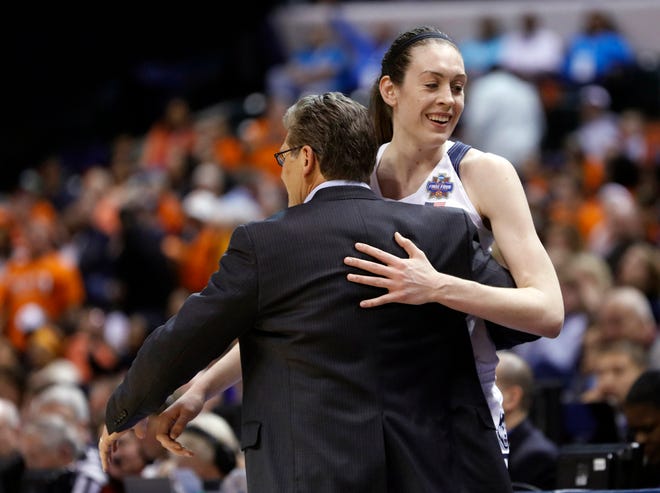 Connecticut's Breanna Stewart is greeted by head coach Geno Auriemma as she is taken out of the game during the second half of Sunday's Final Four game.