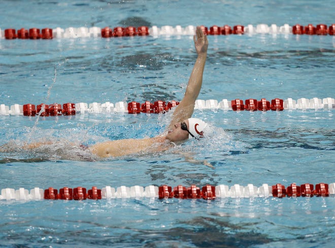 Connor Oslin swims backstroke against LSU on November 11, 2014 Photo by Amelia J. Brackin
