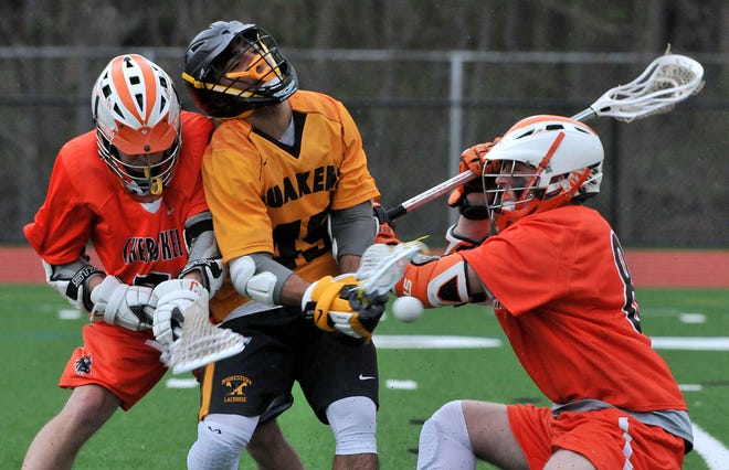 Moorestown's Frank Labetti (45) is double-teamed by Cherokee's Tom Meindl (7) and Dylan Kelso (8) during a game Monday, April 4, 2016.