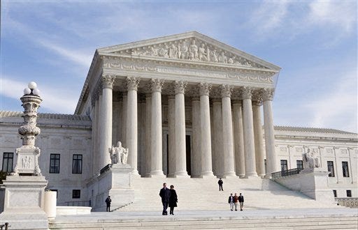The Supreme Court Building is seen in Washington. The Supreme Court has unanimously upheld a Texas law that counts everyone, not just eligible voters, in deciding how to draw electoral districts.