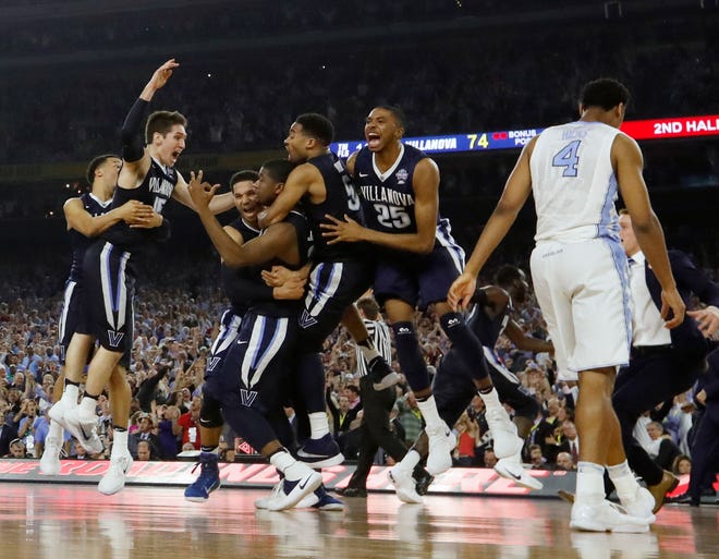 Villanova players celebrate after defeating North Carolina for the NCAA national title on Monday in Houston. (The Associated Press)