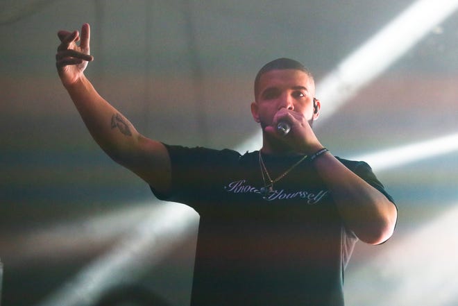 FILE - In this March 19, 2016 file photo, Drake performs during the South by Southwest Music Festival in Austin, Texas. Drake released two new songs to iTunes,Tuesday, April 5, including one that features both Jay Z and Kanye West called "Pop Style." (Photo by Jack Plunkett/Invision/AP, File)