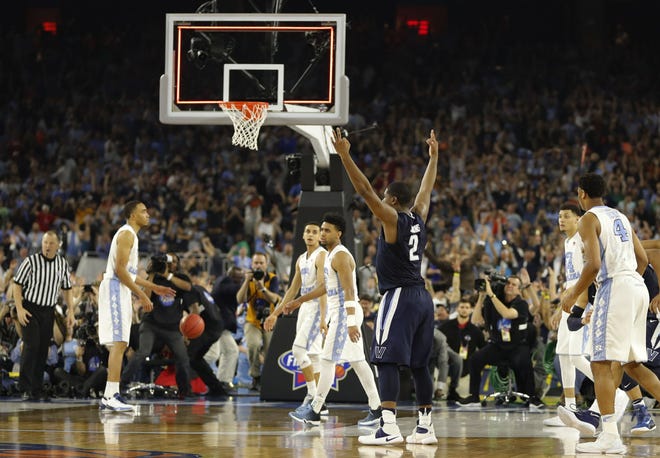 (File) Villanova's Kris Jenkins (2) reacts to his game-winning 3-point basket at the buzzer in the national championship game against North Carolina last year.