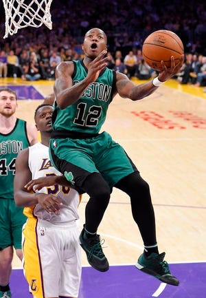 Celtics guard Terry Rozier drives to the basket against the Lakers.