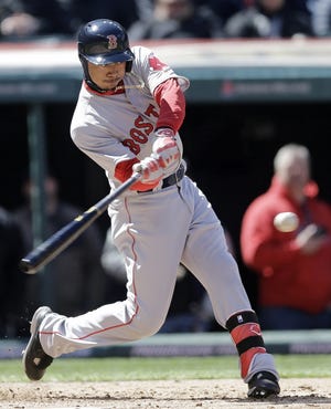 Boston's Mookie Betts connects on a two-run home run in the third inning of Tuesday's season opener at Cleveland. AP Photo