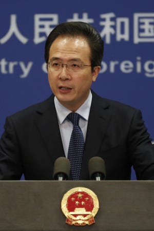 China's Foreign Ministry spokesman Hong Lei speaks during a daily briefing at the Ministry of Foreign Affairs office in Beijing, Tuesday, April 5, 2016. The ministry on Tuesday denounced as ìgroundlessî reports based on documents leaked from a Panama-based law firm that name relatives of current and retired Chinese politicians, including President Xi Jinping, as owning offshore companies. Hong said he would not further discuss the reports and declined to say whether the individuals named would be investigated. (AP Photo/Andy Wong)