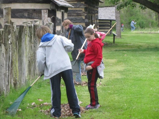 A cleanup day takes place at the Historic Schoenbrunn Village. PHOTO PROVIDED