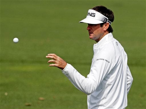 Bubba Watson catches a golf ball on the driving range during a practice round for the Masters golf tournament Wednesday, April 6, 2016, in Augusta, Ga. (AP Photo/Chris Carlson)