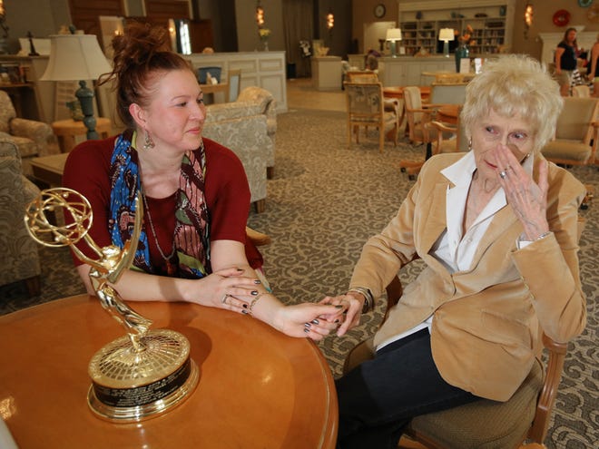 Florence Jarzynko, right, tells her daughter Nancy Jarzynko how proud she is of her for winning an Emmy. Nancy brought the award to show her mother during a visit to Marion County last month.