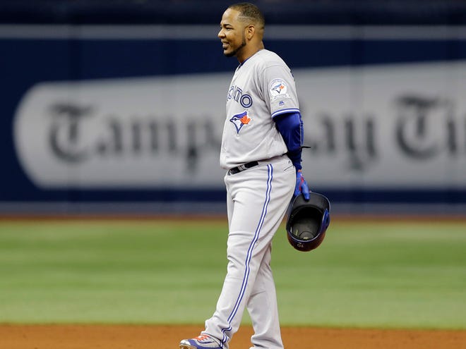 Toronto Blue Jays' Edwin Encarnacion stands at second base after the umpire's review said Jose Bautista interfered with Tampa Bay Rays second baseman Logan Forsythe during the ninth inning of a baseball game Tuesday, April 5, 2016, in St. Petersburg. The Rays won 3-2.