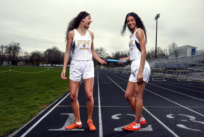 Alexis, left, and Lunden Henry have fun for a picture, but on the track for Southeast High School they're serious competitors.The two were photographed at Southeast High School Wednesday, March 30, 2016. Rich Saal/The State Journal-Register
