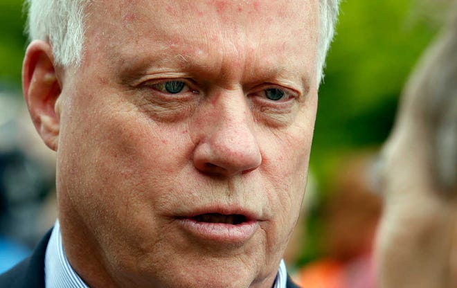 Rep. Paul Broun, R-Ga, and candidate for US Senate talks to voters during the "Grillin with the Governor" campaign event Saturday, May 17, 2014 in Buford, Ga. (AP Photo/John Bazemore)
