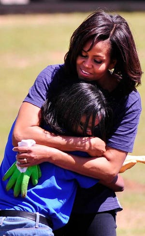 First lady Michelle Obama helped sixth-graders plant cucumbers and peppers in the garden at Burke County Middle School.