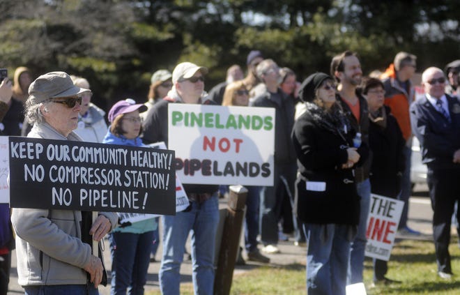(File) Opponents of a proposed New Jersey Natural Gas pipeline through northern Burlington County and a related project to construct a natural gas compressor station in Chesterfield listen to speakers at a rally in the Holy Cross Lutheran Church parking lot in Bordentown Township Saturday, Feb. 27, 2016.