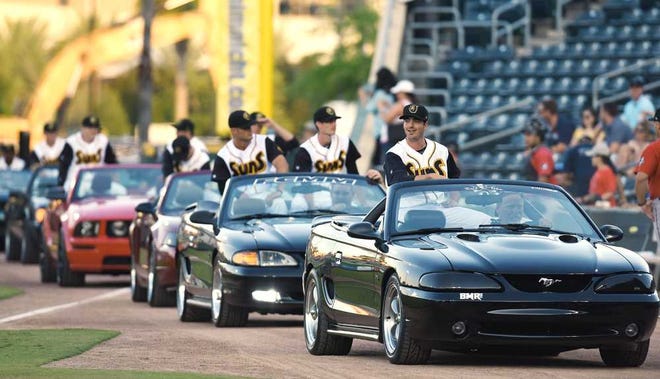 Bob.Self@jacksonville.com Suns players make their entrance into the Baseball Grounds of Jacksonville in a motorcade of Mustangs for the season opener on Thursday night against the Barons.