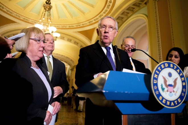 Senate Minority Leader Harry Reid of Nev., center, accompanied by, from left, Sen. Patty Murray, D-Wash., Senate Minority Whip Richard Durbin of Ill. and Sen. Charles Schumer, D-N.Y., speaks to reporters on Capitol Hill in Washington, Tuesday, April 5, 2016, following a policy luncheon at the . (AP Photo/Andrew Harnik)
