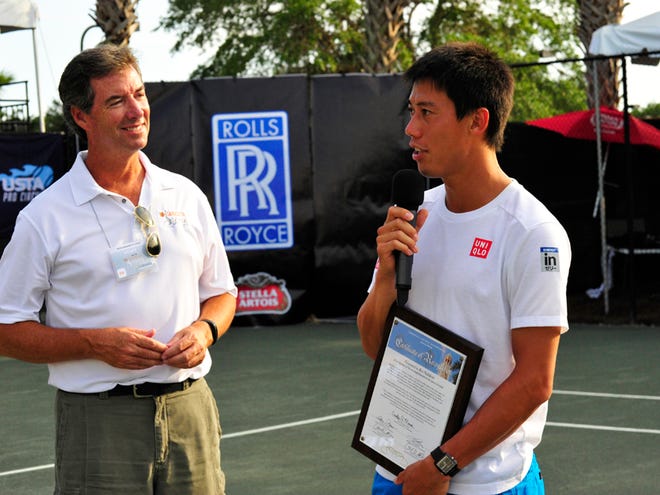 Ray Collins, shown here after introducing Kei Nishikori, is the voice of the Sarasota Open, a USTA Pro Circuit tournament to be played next week at the Lakewood Ranch Tennis and Athletic Center.