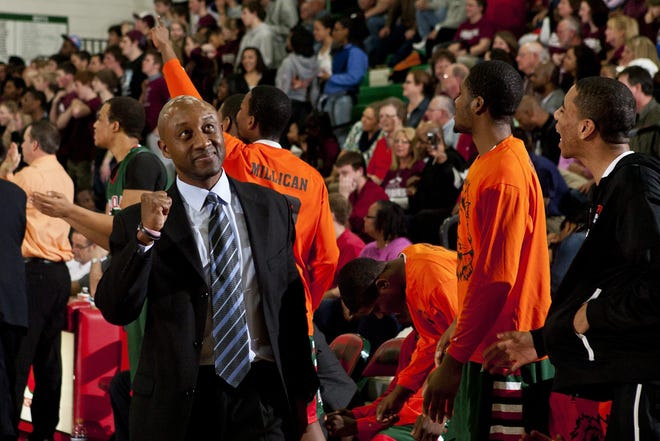 Lanphier boys basketball head coach Chuck Shanklin pumps his fist as the Lions go on a run against Champaign Central in the second half during the Class 3A Lincoln Sectional title game at Roy S. Anderson Gymnasium in Lincoln, Ill., Friday, March 9. 2012. Justin L. Fowler/The State Journal-Register