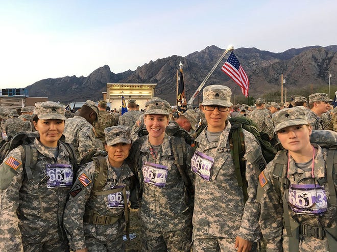From left to right: Cholpon Atabekova, Sgt Osipe Jumamudunova, Spc Sarah Mongold, Sgt Terri Bluebird and Spc Amy Green participate in the Bataan Memorial Death March at White Sands Missle Range, New Mexico March 20.