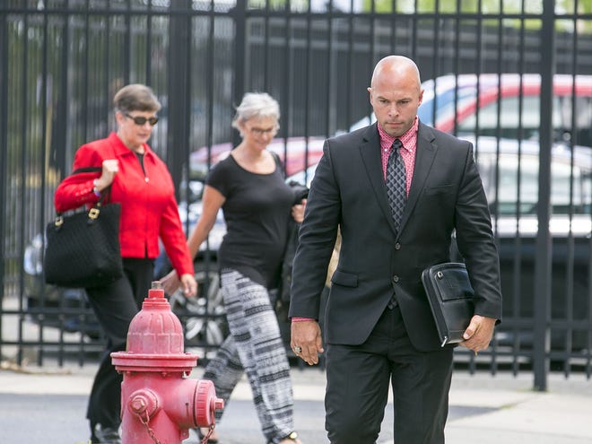 Former Marion County sheriff's deputy Jesse Alan Terrell walks to federal court to continue his trial for excessive force on Thursday.