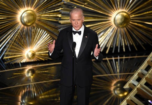 FILE - In this Feb. 28, 2016 file photo, Vice President Joe Biden introduces a performance by Lady Gaga at the Oscars in Los Angeles. Expect plenty of applause for Biden and superstar performer Lady Gaga when they take the stage at an event in Las Vegas on Thursday, April 7, to raise awareness about sexual assault at schools and college campuses. (Photo by Chris Pizzello/Invision/AP, File)