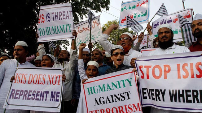 Indian Muslims protest against ISIS during a rally in India following the Paris attacks last November.