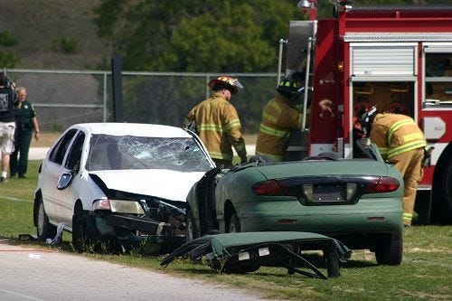 Lake County Fire Rescue is pictured during a recent mock DUI using real wrecked vehicles and student actors.