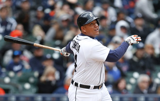 Detroit Tigers' Miguel Cabrera watches his solo home run against the New York Yankees in the seventh inning of a baseball game, Friday, April 8, 2016, in Detroit. (AP Photo/Paul Sancya)