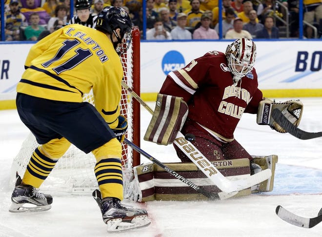 Boston College goalie Thatcher Demko makes a save on a shot by Quinnipiac forward Tim Clifton during the second period of an NCAA Frozen Four semifinal college hockey game Thursday, April 7, 2016, in Tampa, Fla.