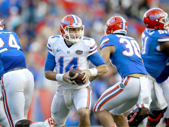 Florida Gators quarterback Luke Del Rio fakes a handoff during the Orange and Blue Debut. Del Rio finished 10 of 11 for 176 yards and two touchdowns.