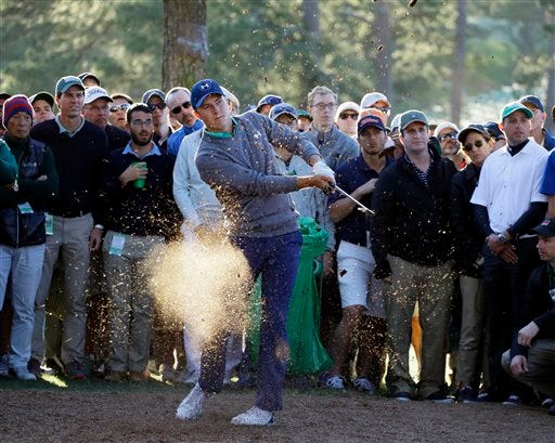 Jordan Spieth hits out of the rough off the 17th fairway during the third round of the Masters golf tournament Saturday, April 9, 2016, in Augusta, Ga. (AP Photo/Matt Slocum)