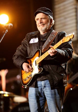 FILE - This Jan. 24, 2014 file photo shows country singer Merle Haggard during a rehearsal for the 56th Annual Grammy Awards in Los Angeles. Haggard died of pneumonia, Wednesday, April 6, 2016, in Palo Cedro, Calif. He was 79. (Photo by Matt Sayles/Invision/AP, File)