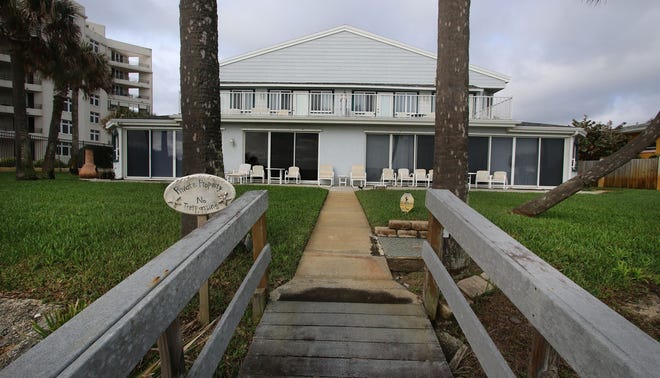 The back of the two-unit condominum for sale at 375 S. Atlantic Ave. in Ormond Beach includes a ground floor patio, dune walkover to the beach and a second-floor balcony. News-Journal/JIM TILLER
