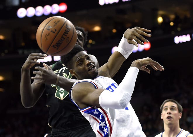 The 76ers' Nerlens Noel (4) collides with the Bucks' Johnny O'Bryant (77) during Sunday's game at the Wells Fargo Center.