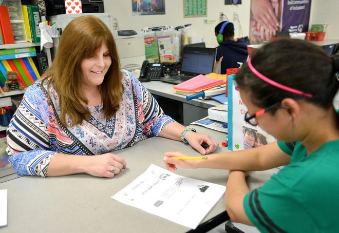 Teacher of the Year candidate Andrea Vineyard works with student Briana Irizarry in her classroom at Tavares High School. The percentage of highly effective teachers in Lake County has dropped to 11.3 percent. Meanwhile, the percentage of highly effective administrators remains at 68.9 percent.Top teacher