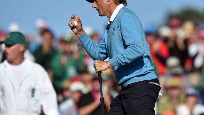 Bernhard Langer waves to the crowd on the 18th green during the third round of the 80th Masters at the Augusta National Golf Club in Augusta, Ga., on Saturday, April 9, 2016. (Brant Sanderlin/Atlanta Journal-Constitution/TNS)