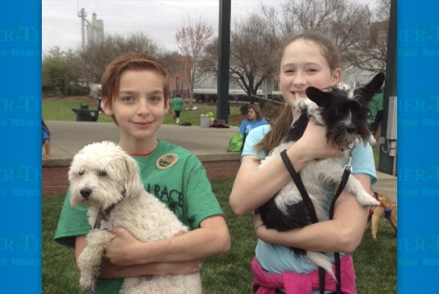 HELPING OUT — Hayden Marckwardt-Tero, left, raised $135 and walked Frodo in The Human Race while Payton Knott, who raised $190, had the honor of walking Chewie. (Contributed photo) 
 FROM NAMS — Woof Gang Club members turned out to walk for RCSPCA at The Human Race in Asheboro. (Contributed photo)