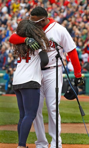 David Ortiz hugs his 15-year-old daughter Alex after she sang the national anthem during the home opener at Fenway Park, Monday, April 11, 2016.