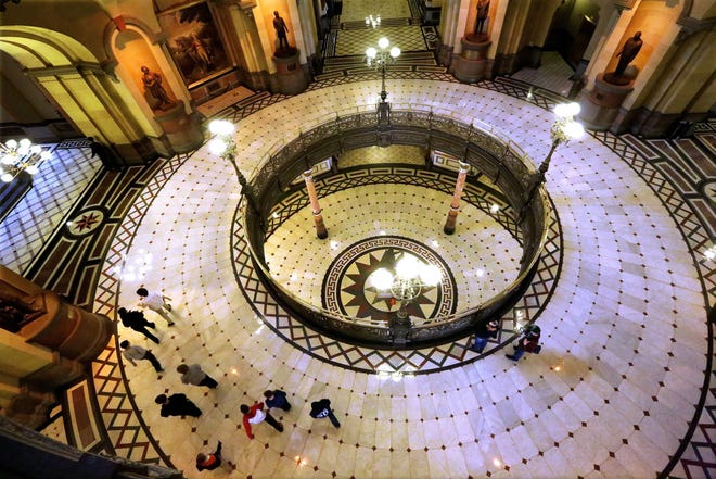 In this Friday, Oct. 24, 2014 photo, visitors tour the second floor rotunda at the Illinois State Capitol in Springfield, Ill. (AP Photo/Seth Perlman)
