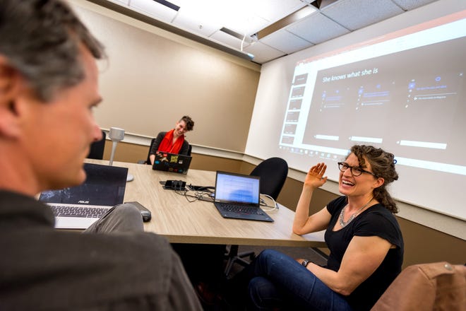 At Microsoft's campus in Redmond, Wash., members of the writing team — which includes poets, novelists, playwrights and a former television writer — for the Cortana artificial intelligence project work to shape its psyche. Leading the meeting is Deborah Harrison, writer and senior content developer. Must credit: Photo by Stuart Isett for The Washington Post
