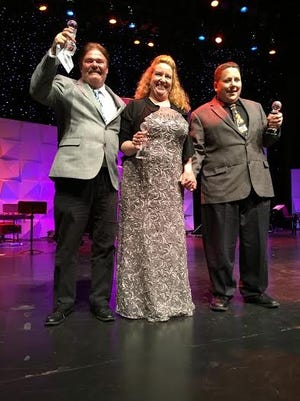 Members of The Greatest Gift accept their trophies for Gospel Band of the Year and Album of the Year at the North American Country Music Association’s International Competition in Pigeon Forge, Tennessee. Pictured from left to right are Wayne Patterson, Kris Smith and Mike Biasin. COURTESY PHOTO BY MIKE SMITH