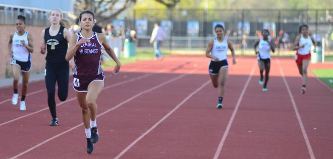 Salina Central’s Jetta Greene pulls away from the field in the girls 400-meter dash. Greene also won the long jump with a personal-best mark of 17-2.
