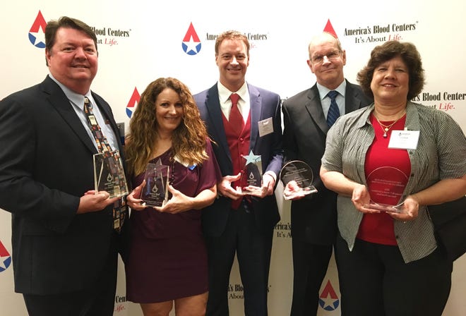 America's Blood Centers honorees, from left, Anna Maria Oyster Bar's John Horne, and from SunCoast Blood Bank: Pam Foster, CEO Scott Bush, Mike Buell and Cora Buell.