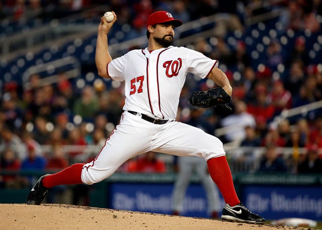 Washington Nationals starting pitcher Tanner Roark throws during the third inning of a baseball game against the Atlanta Braves at Nationals Park, Wednesday, April 13, 2016, in Washington. (AP Photo/Alex Brandon)
