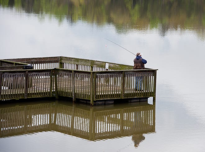 Charles Rogers casts his fishing line at Lake Thom-A-Lex on Tuesday despite only getting a nibble here and there from crappie. Rogers attributed the slow results to the change in weather, specifically the change in barometric pressure. Donnie Roberts/The Dispatch