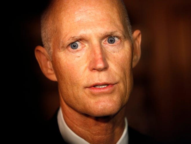 Gov. Rick Scott speaks to members of the media before his luncheon with The Florida Council of 100 at the Ponte Vedra Inn and Club on Nov. 20, 2015.