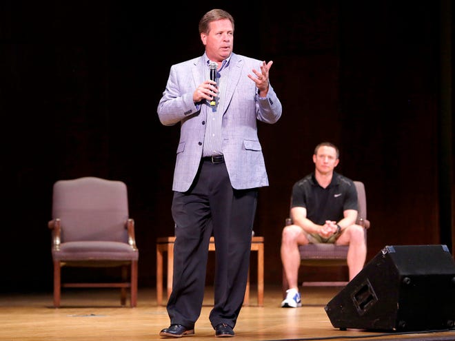 Head football coach Jim McElwain speaks to the crowd as head men's basketball coach Mike White listens at the University Auditorium on Tuesday, April 12, 2016 in Gainesville. The event was put on by the Accent Speakers Bureau.