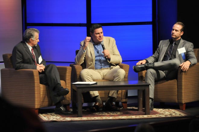 Christopher Thornberg, director of the University of California Riverside Center for Ecomonmic Forecasting, center, answers questions from the audience along with Mojave Water Agency General Manager Kirby Brill, left, and MWA Director of Basin Management and Resource Planning Lance Eckhart at the 2016 High Desert Water Summit at Barstow Community College's Performing Arts Center on Wednesday. David Pardo, Daily Press