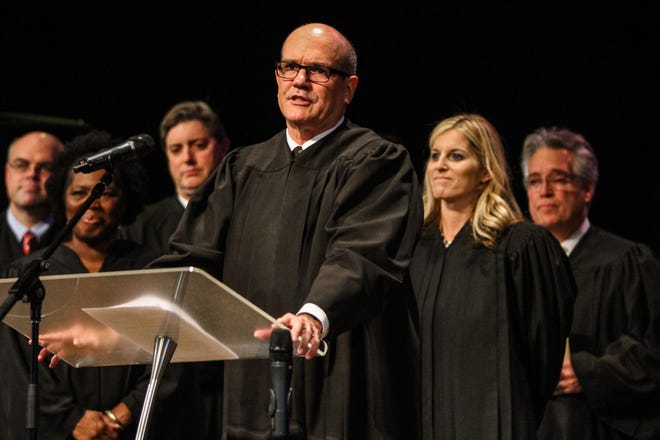 News-Journal/LOLA GOMEZ  The Honorable James R. Clayton gives the adjournment at the end of the the Volusia County Court Judge Angela Dempsey investiture held at the First Assembly Church of God in DeLand on Friday, January 30, 2015.