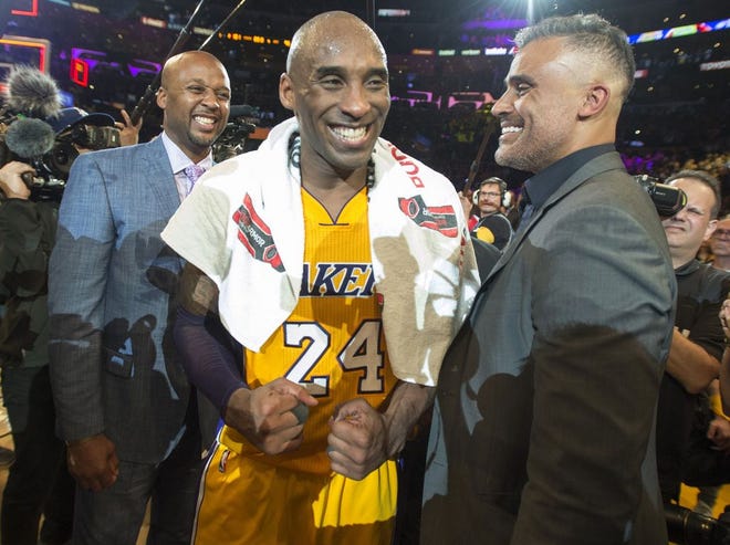 Los Angeles Lakers' forward Kobe Bryant reacts with former teammates Brian Shaw, left, and Rick Fox after an NBA basketball game against the Utah Jazz at Staples Center in Los Angeles, on Wednesday, April 13, 2016. Kobe Bryant went out with a Hollywood ending to his remarkable career. He scored 60 points in his final NBA game Wednesday night, wrapping up 20 years in the NBA with an unbelievable offensive showcase in the Lakers' 101-96 victory over the Utah Jazz. (Michael Goulding/The Orange County Register via AP)  MAGS OUT; LOS ANGELES TIMES OUT; MANDATORY CREDIT
